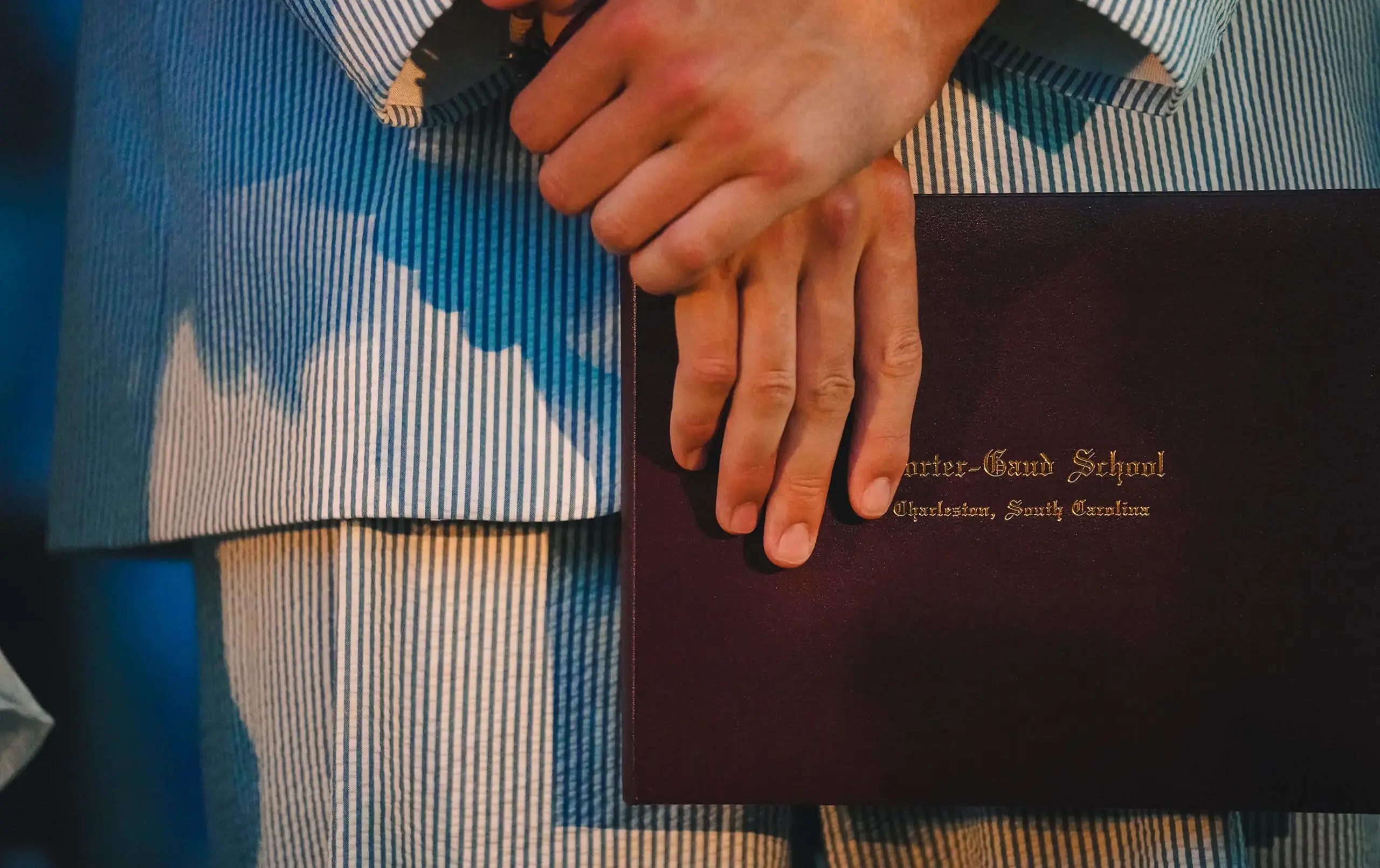 Porter Gaud student holding their diploma