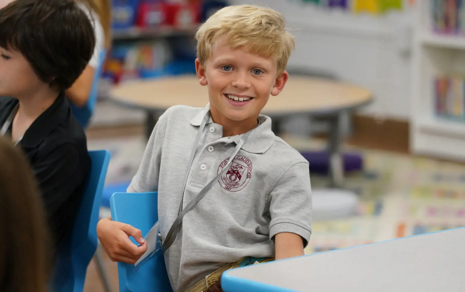 Smiling Boy at a Desk