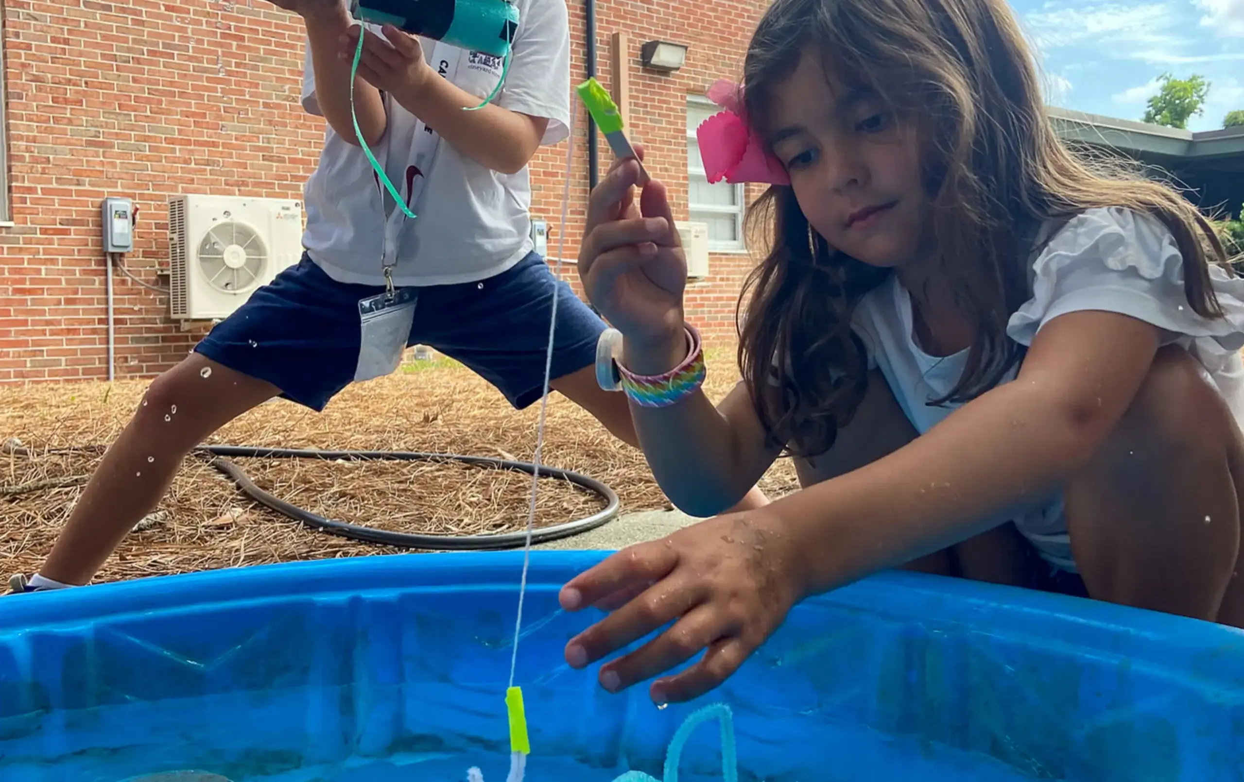 Camp Cyclone student playing fishing game